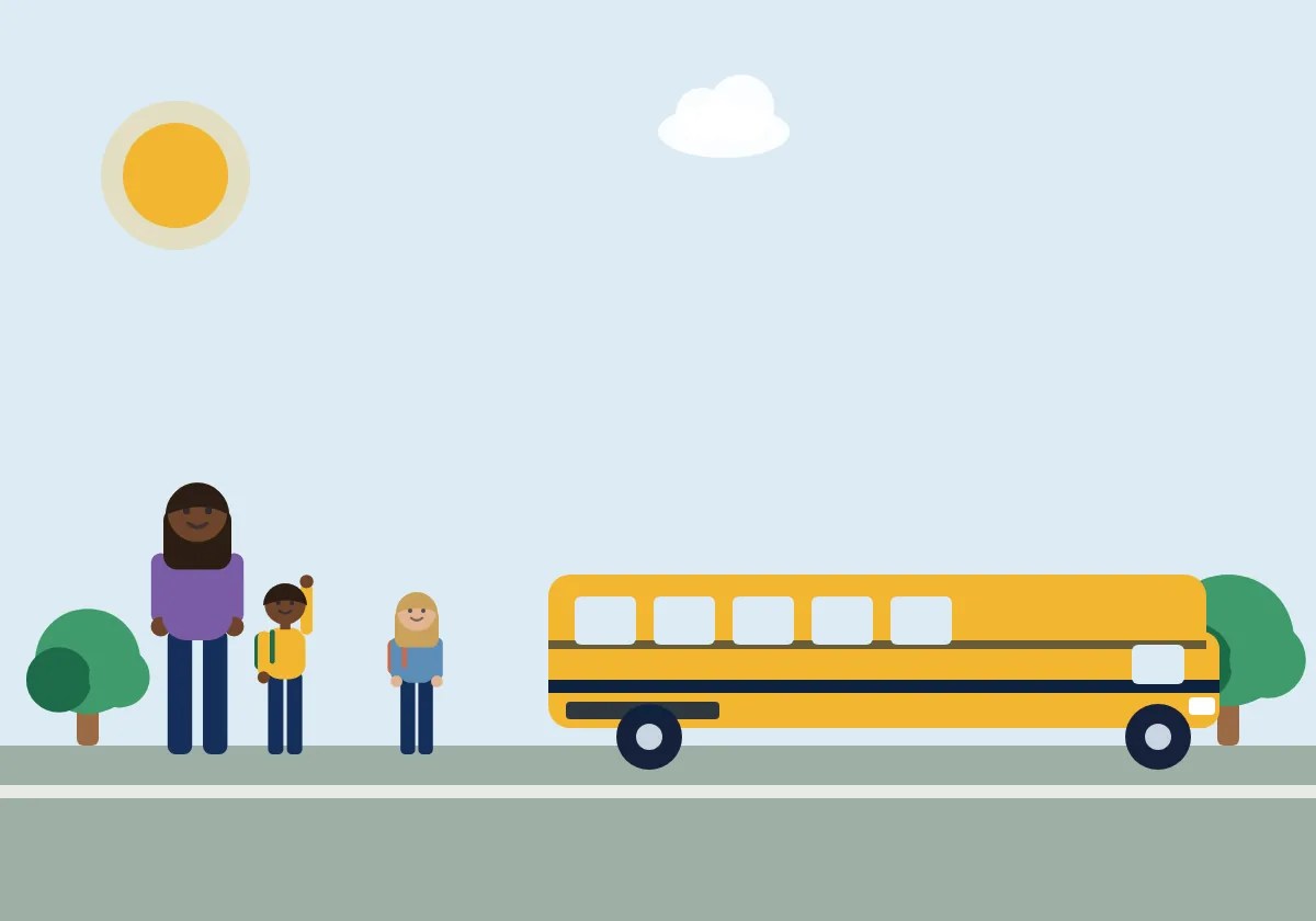 A parent and children waving at a school bus in the morning